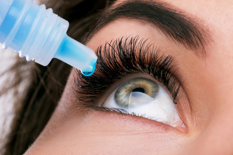 Woman and eye drops